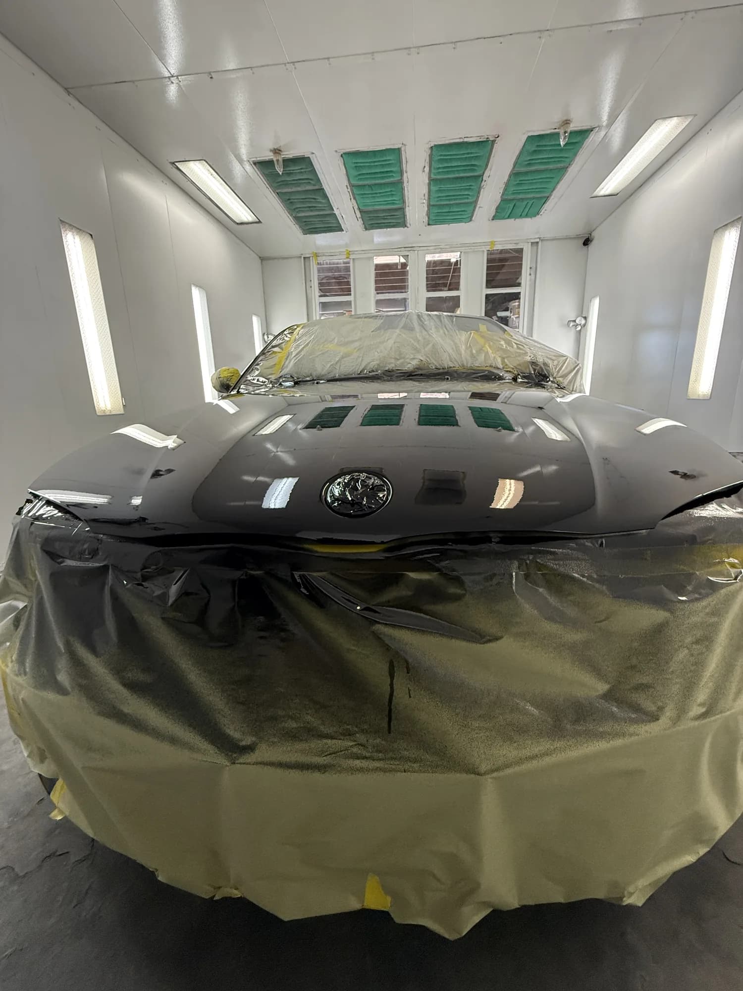 Vehicle in the downdraft paint booth ready for colour